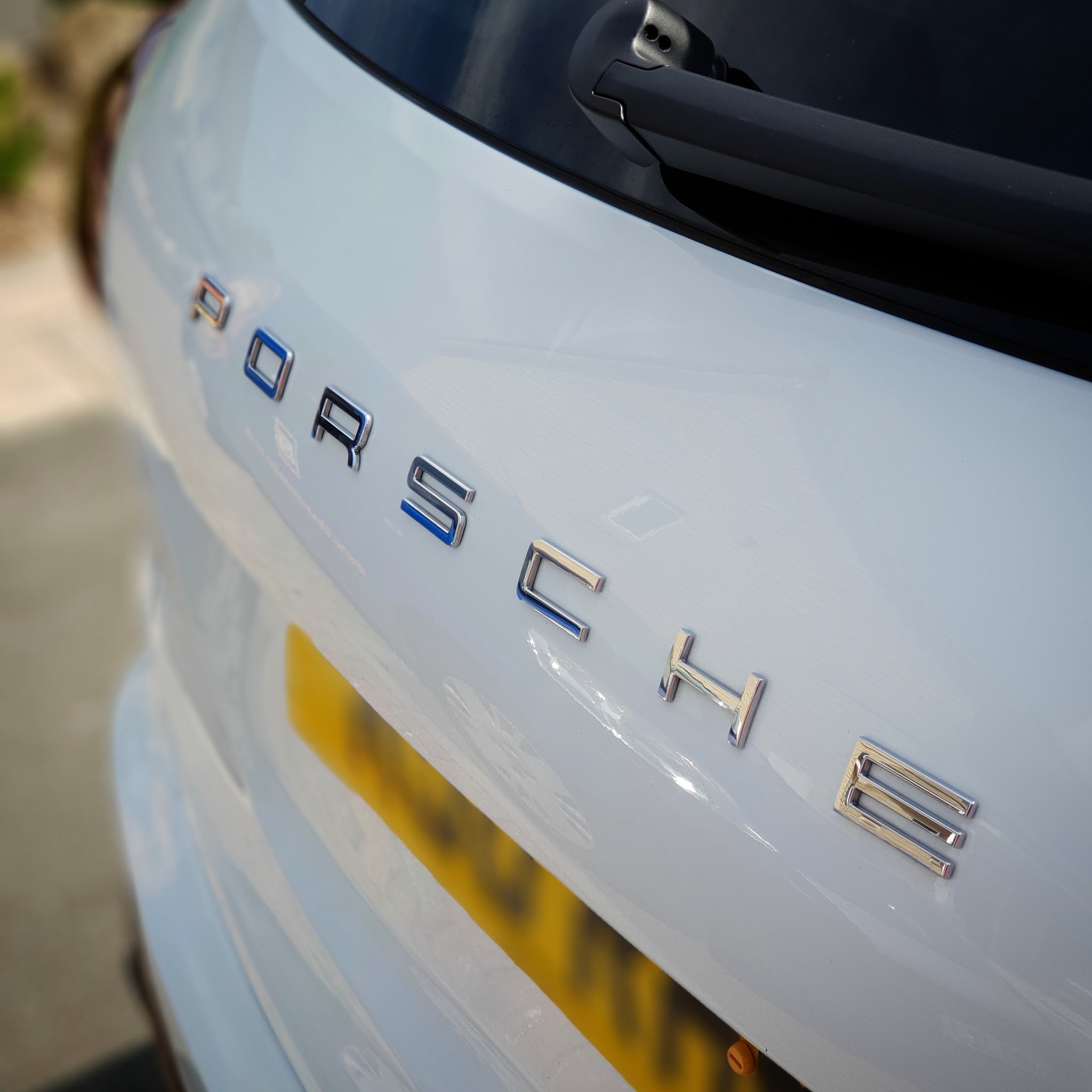 Close view of the polished rear of a white car